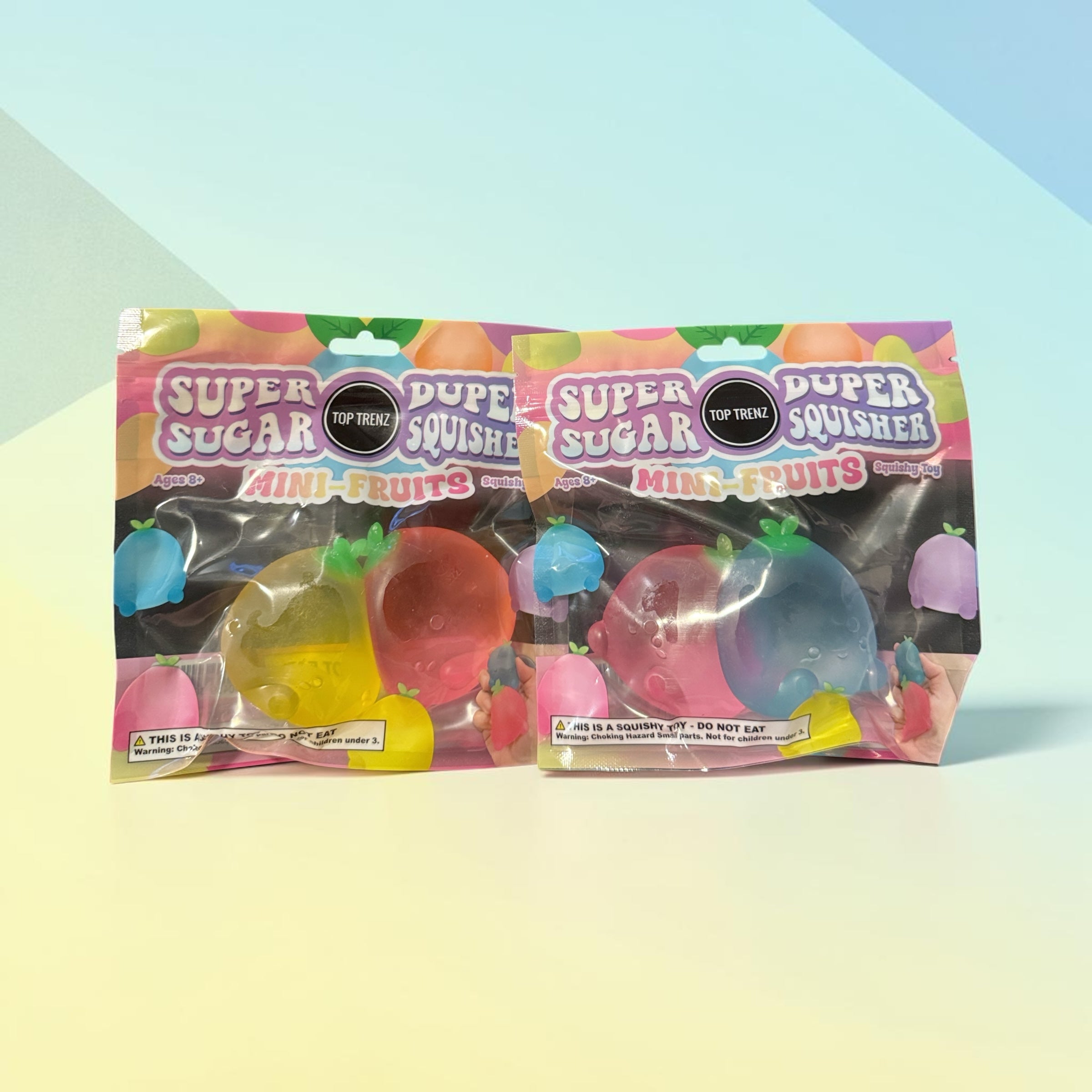Trendzy Creations TOP TRENZ Super Sugar Duper Squisher mini fruit sensory toys in two sealed retail packages.